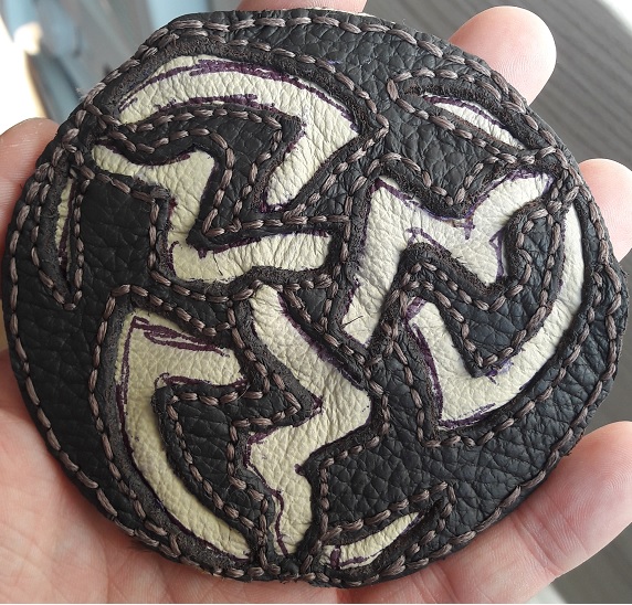 Handmade leather edge symbol prototype